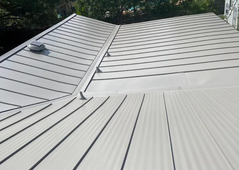 Solar attic fan installed on a metal roof for Roof Ventilation in Laie
